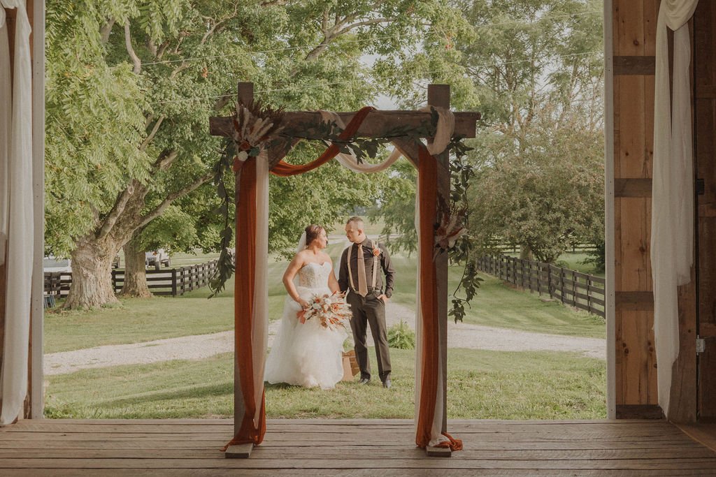 Bride and groom at Columbus  Ohio wedding venue with countryside backdrop