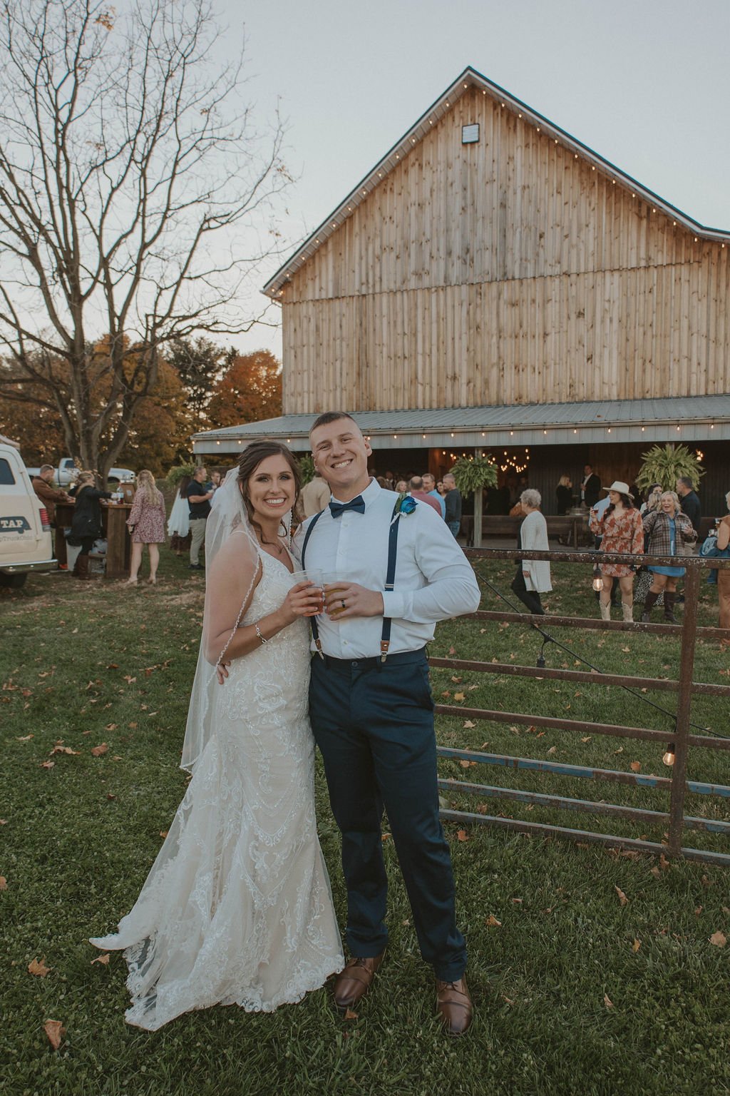 happy married couple at their barn wedding with tap truck in Ohio