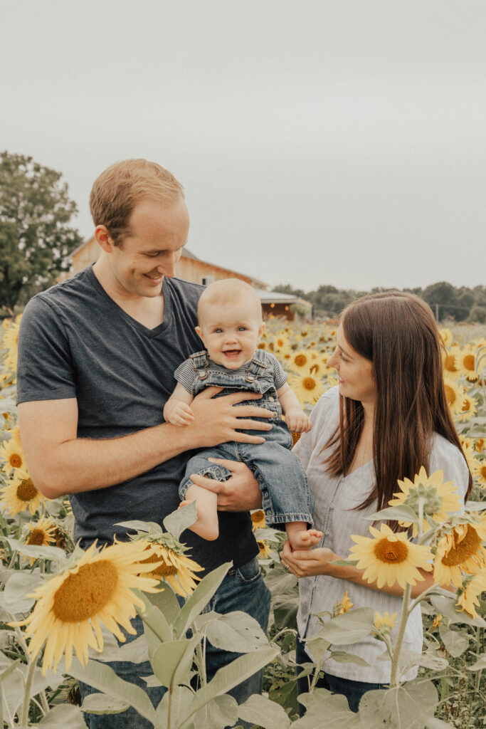 A family in a sunflower field