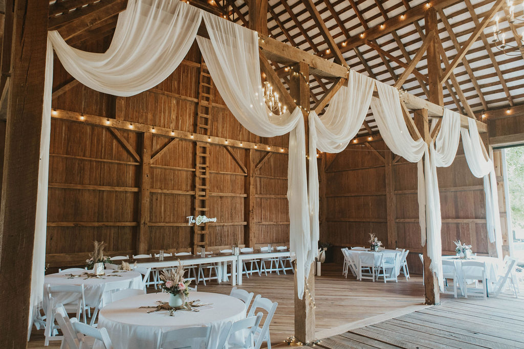 A beautiful wedding reception setup in a barn wedding venue at 22 Acres Farm outside Columbus, Ohio.