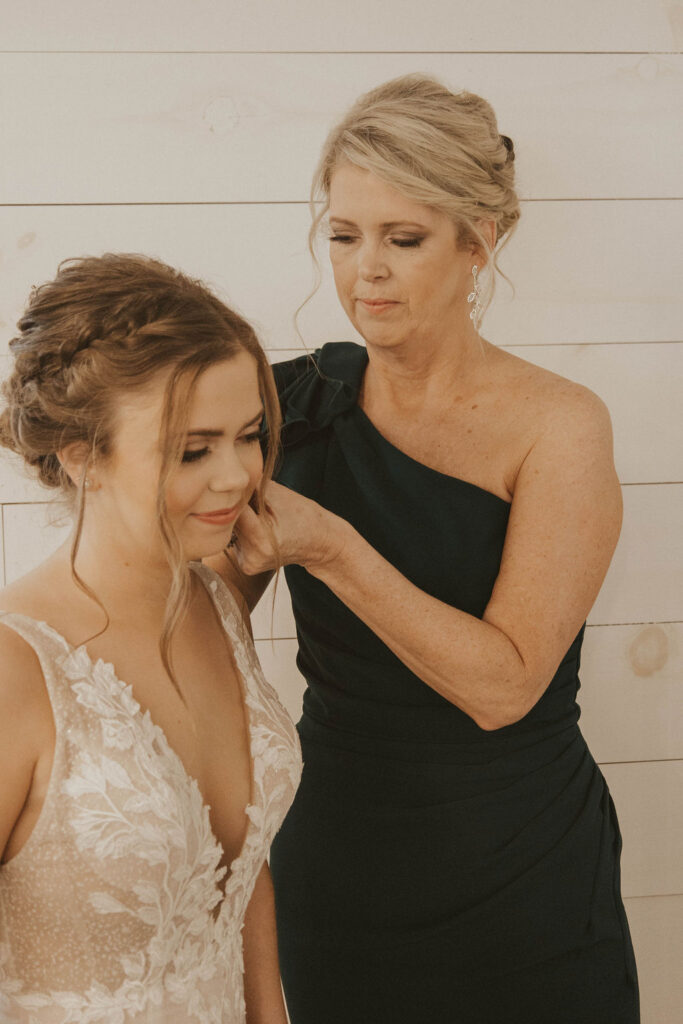 A bride and her mother preparing for the wedding day.