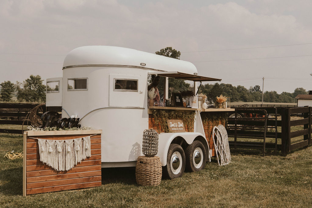 A mobile bartender in a barnyard outside a Columbus, Ohio wedding venue