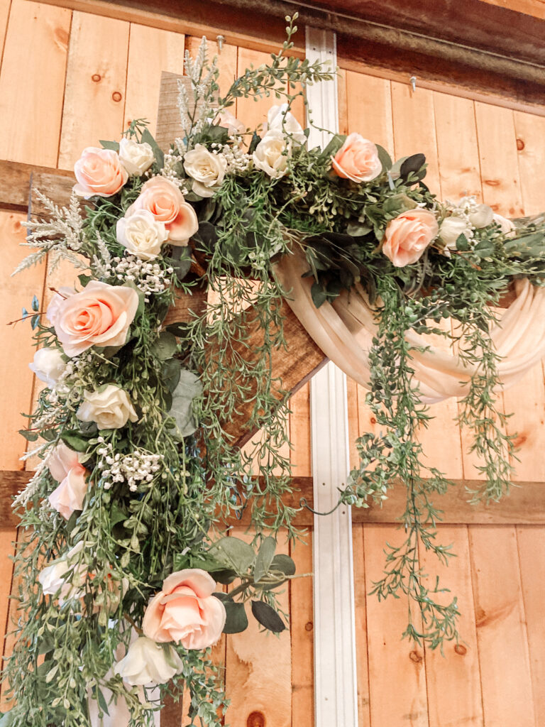 wedding ceremony barn wood archway with flowers in a barn wedding venue near Columbus Ohio