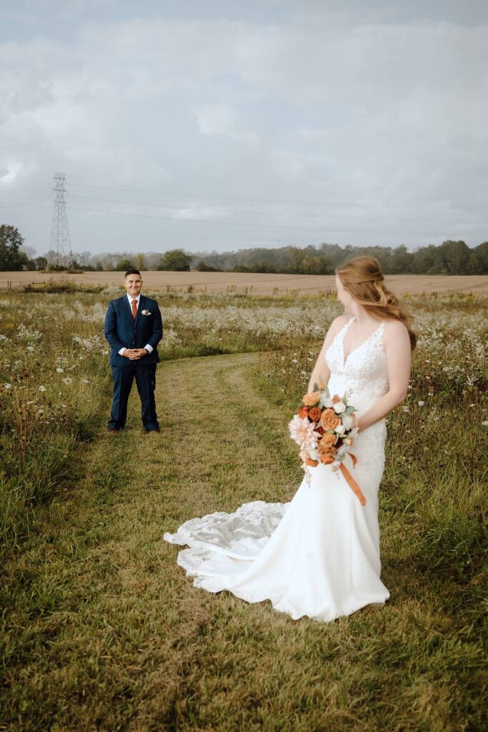 a bride and groom looking at each other in the Columbus Ohio area countryside