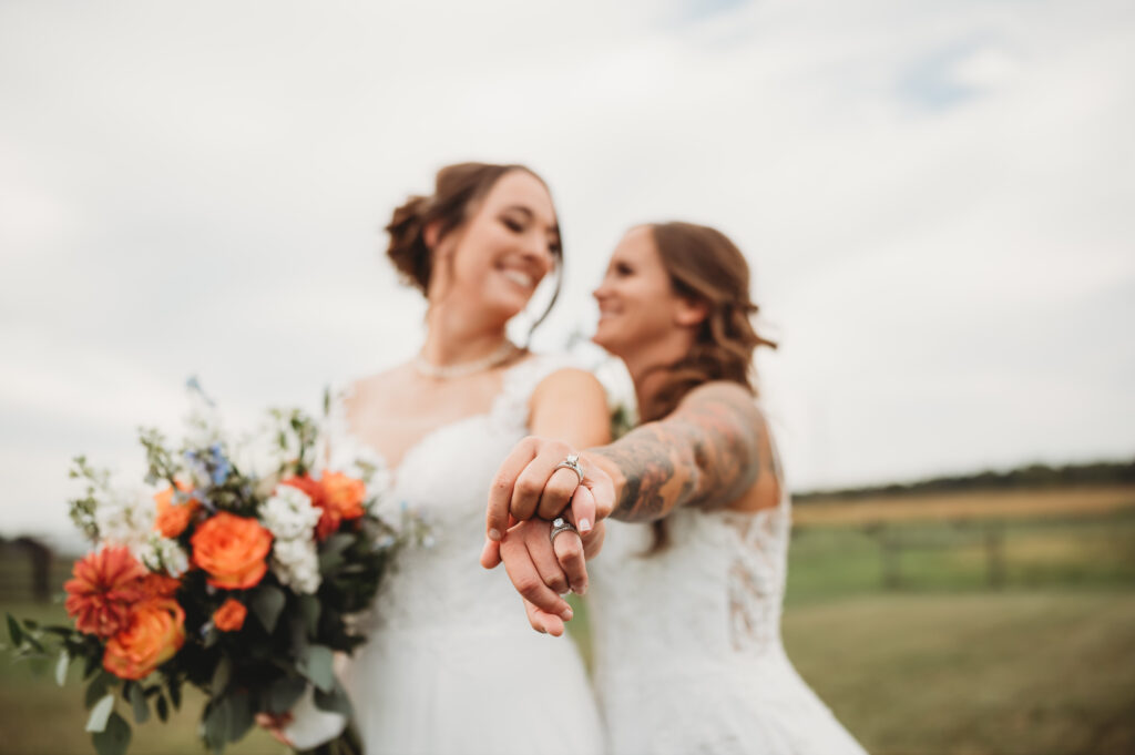 two brides at their rustic countryside wedding