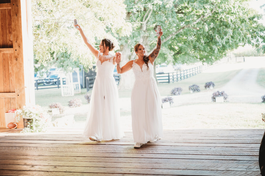 two brides entering their reception at their barn wedding outside Columbus Ohio