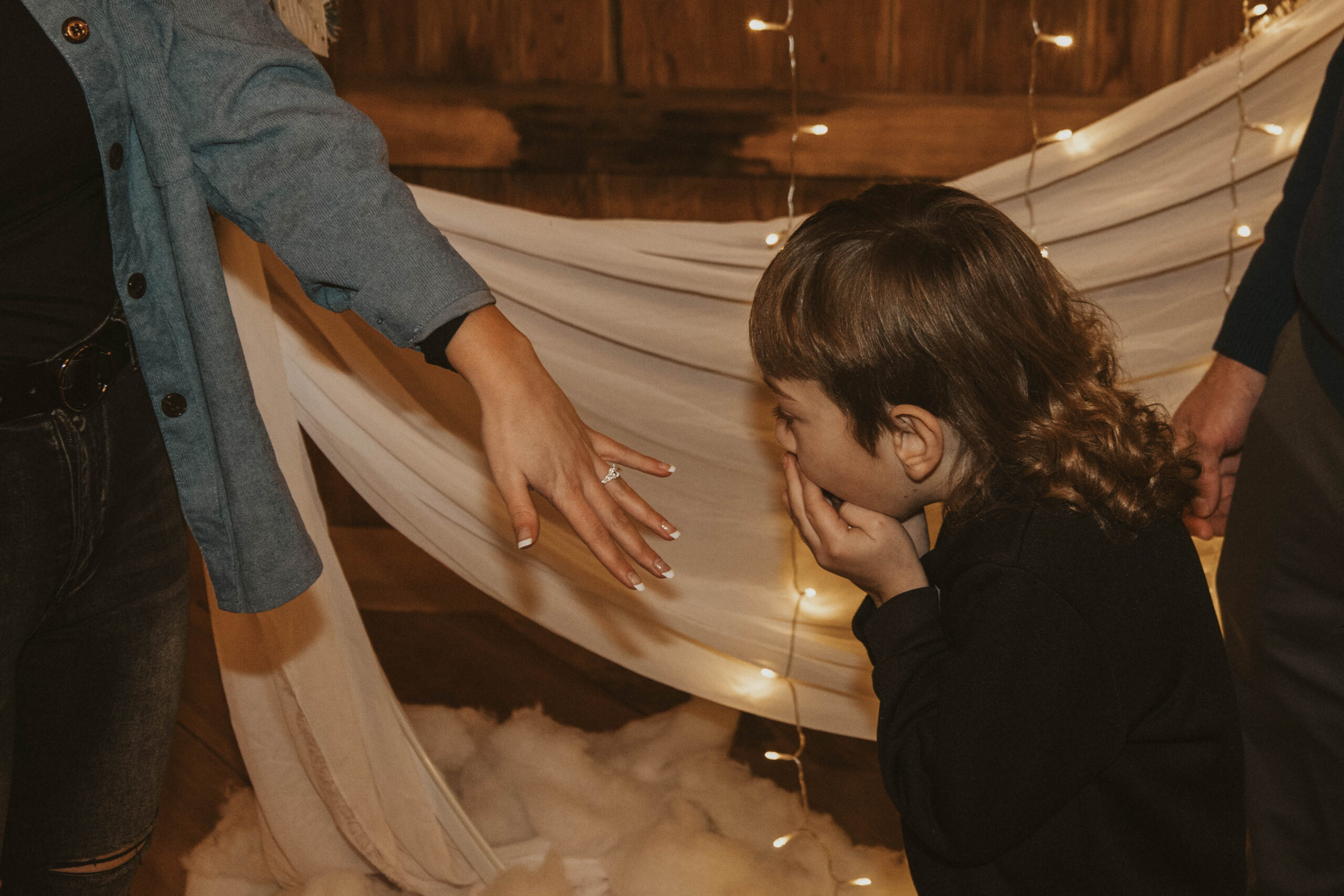 Child at 22 Acres Farm in awe of new engagement ring.