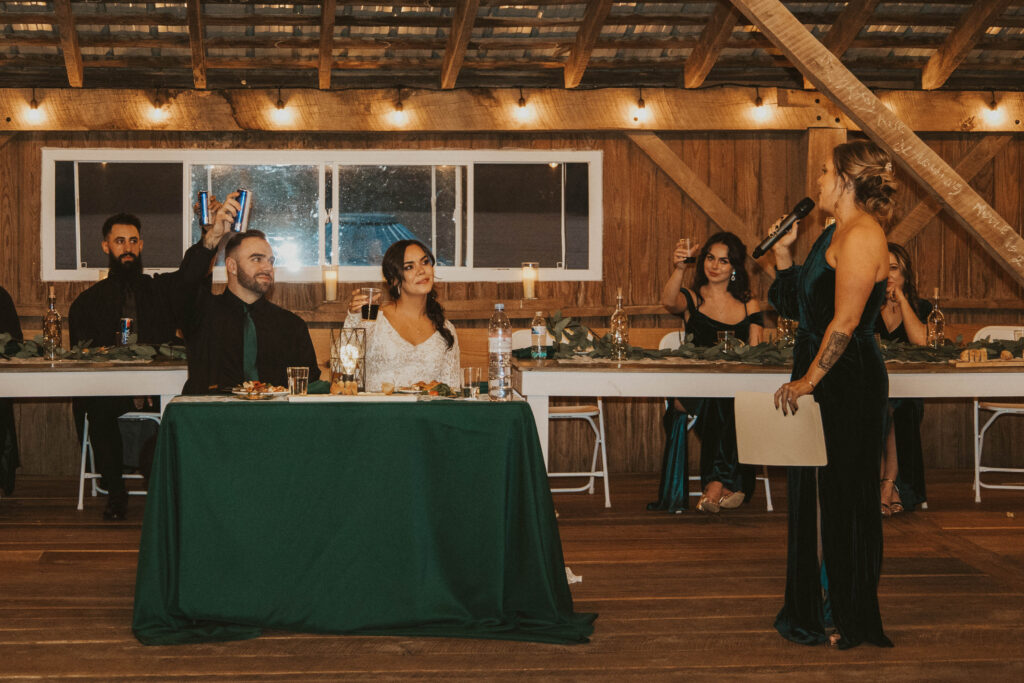  joyful Maid of Honor raising a glass, delivering an emotional and celebratory speech for the happy couple.