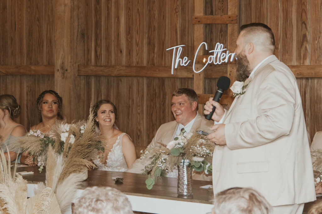 A charismatic Best Man sharing a humorous and touching story about the groom, engaging the wedding guests with laughter and love.