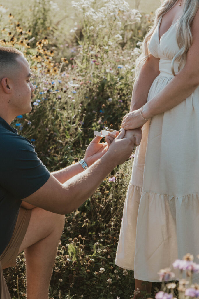 A breathtaking proposal scene with a flower-filled backdrop and rustic charm in Central Ohio.