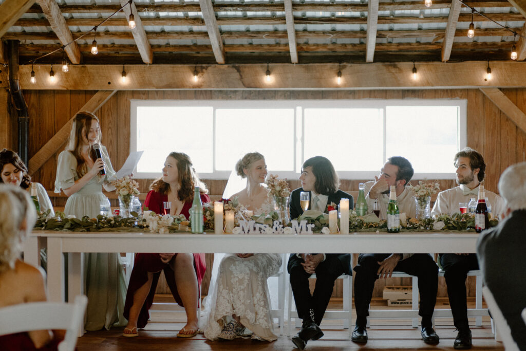 A bridesmaid shares a toast at a charming Columbus, Ohio wedding at 22 Acres Farm.