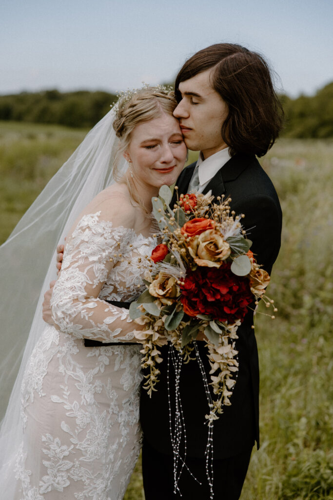 A bride and groom share an emotional embrace at their Columbus, Ohio wedding.