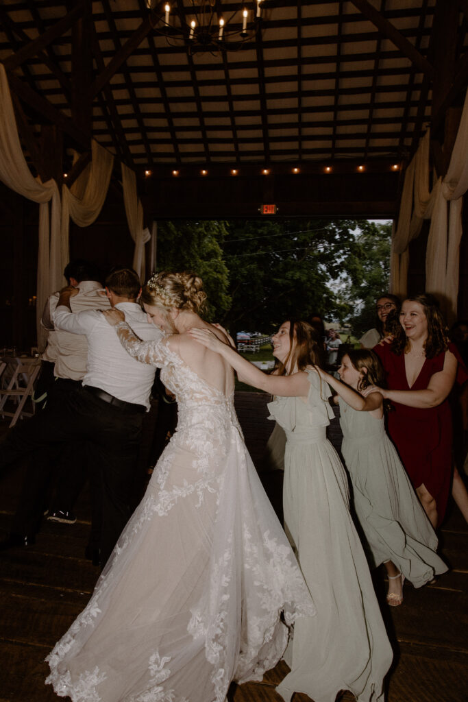 A bride dancing with her Columbus, Ohio guests last June at 22 Acres Farm.