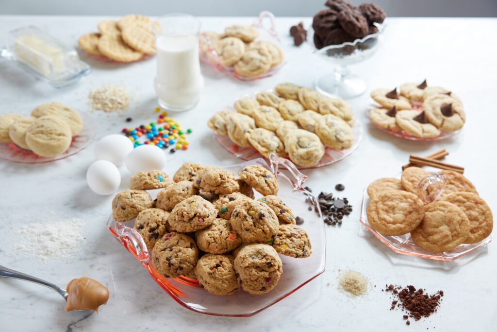 Peanut butter monster cookies filled with colorful candies displayed on a dessert table in Central Ohio.