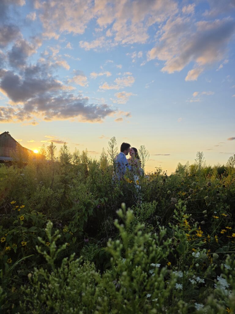 Wildflower fields with wedding couple @22acresfarm.com