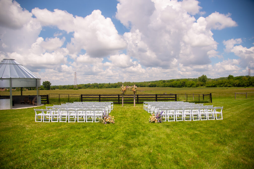 Outdoor ceremony space facing Highland cow pasture at 22 Acres Farm in Newark, ohio