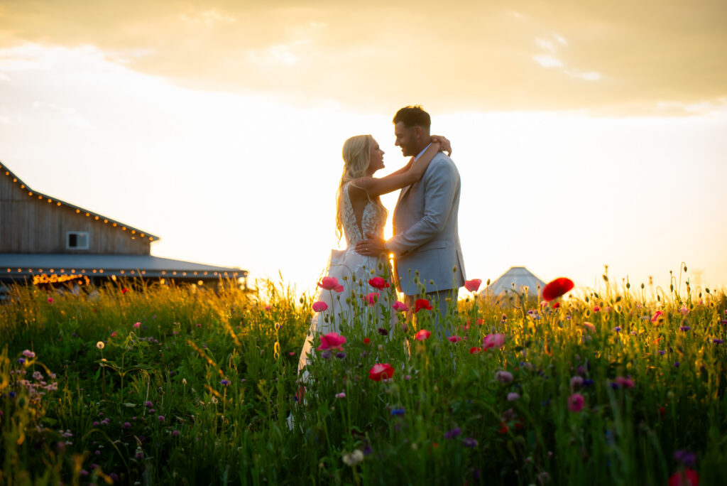 Couple photos at wedding at 22 Acres Farm in wildflower fields