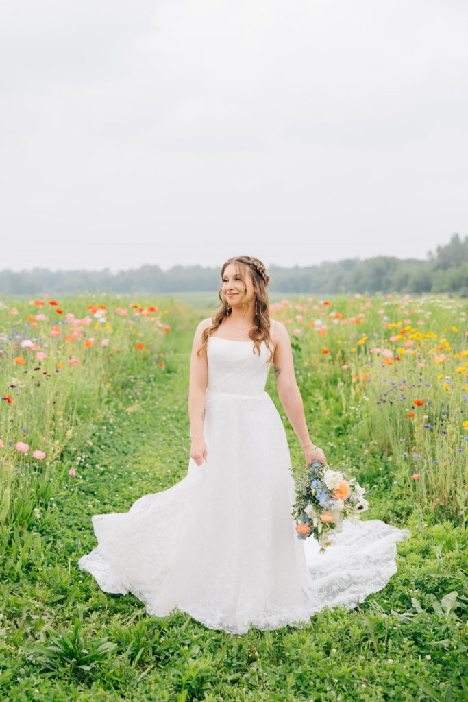 stunning bride photos in wildflower fields at 22 Acres Farm